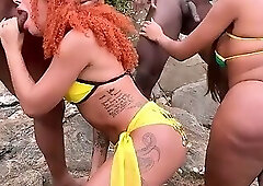 Young trans girls meet two black guys on the beach and can't resist giving them their asses.