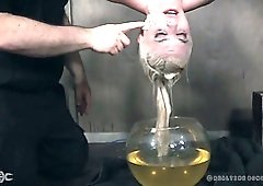 Pale short haired auburn slut Dresden is tied up and put into fish globe