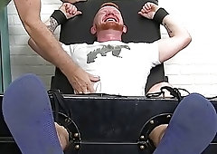 Bearded stud with red hair restrained for naughty tickling domination