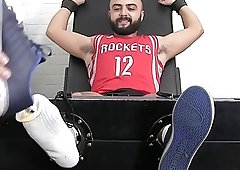 Stud restrained to have his body tickled by two guys