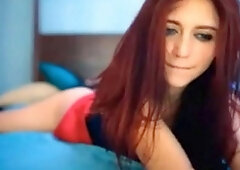 Redhead beauty reaches orgasm on webcam alone.