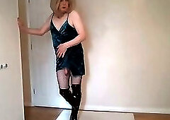 Blonde in blue cocktail dress, fishnets and boots