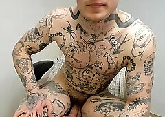 Heavily Tattooed Guy Showing Off Everything