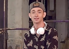 Submissive twink restrained to have his hard dick stroked rough