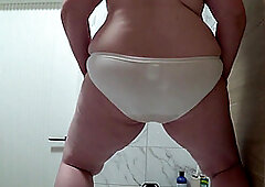Pussy pissed on white panties. Mature bbw urinates, view from below. PAWG.