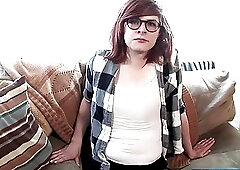 Amateur shemale with nerdy glasses strips nude for solo masturbation