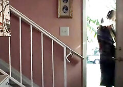 Jennifer Lopez standing in front of a chap as this babe takes her suit off, revealing some cleavage in her brassiere and pants beneath. The man then h