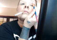 Smoking milf does her make-up with a cigarette buttplug in full throttle