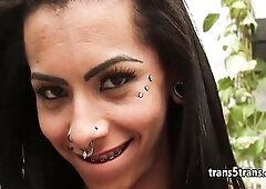 Breasty latin chick sheshaft with tattoos and piercing  all over her face and body sucked large hard knob of some man then got her shemale large ass f