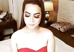 Pretty shemale enjoys masturbation while being watched on a webcam