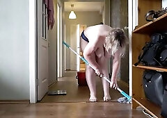 A aged, corpulent mother i'd like to fuck with large, natural, saggy breasts is cleaning the apartment.