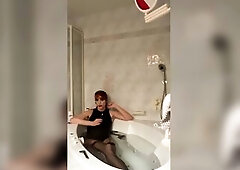 Slender tall tranny in ebony swimsuit and thongs takes a sexy baths whilst smokin'. Then that babe continues to jerk off her massive schlong and 