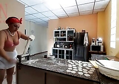 A bare housewife is preparing dinner in the kitchen. The dissolute whimsical housekeeper Brassiere 1