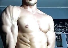 Hunk with muscles is drenched wth sweat after a workout