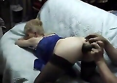 Aged bitch wearing nylons and underware gets her butt banged by a masked guy with a biggest cucumber.