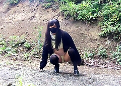 Japanese Crossdresser Pees Openly In The Forest For A Selfie