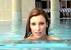 Floral bikini beauty rides hard in indoor pool before taking cumshot to face