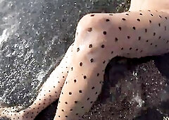 nylondelux is wearing polka dots exposed hose and posing on the beach showing her hawt soaked nylon feet. cum on my feet on the public beach.crave gre
