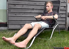 Hot gay hunk gives footjob