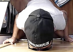 Tattooed gay sucks and strokes hard dick in gloryhole