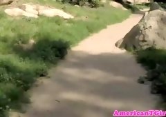 Redhead ladyboy babe stripping outdoors