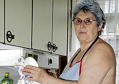 Gorgeous old lady Gerlinde is using a nice cucumber as a dildo