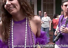 Mature blonde teases exposed during Mardi Gras street parade
