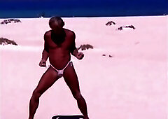 Tanned guy on beach in tiny string thong (temporarily!)