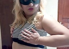 Blonde bombshell Ellie performs a hot and seductive striptease