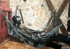 Being in the dungeon, Alex Latex gets on the swing. I tie his hands and feet, gag him, and put a mask over his eyes so this chab can't watch or d