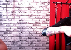 Bdsm. Dominatrix Whipped A Slave Who Is In Shackles