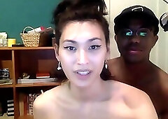 Hipster Sarah Seagreen playing with a black