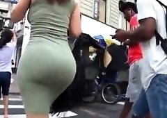 Street voyeur chases an elegant babe with a big round booty