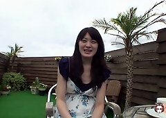 Passionate Asian woman pleasures her partner on a wooden deck and explores herself with a vibrator indoors