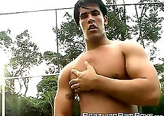 Horny Brazilian jock jerking off his throbbing cock outdoors