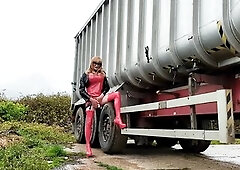 Tgirl jerking off in red pvc at a truck park