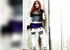 Redhead tall in white nylons posing for a photo in high heels, in a purple MINI petticoat and in a transparent blouse