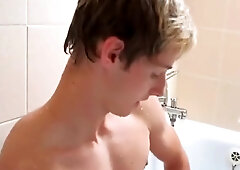 Having fun with a twink in the bathroom