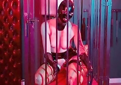 Submissive girl masturbates in hanging cage