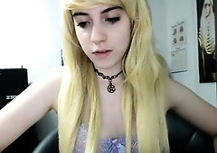 Blonde teen in solo action with her pussy