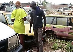 The mechanic has sex with his female customer in the garage whilst her vehicle is being repaired.