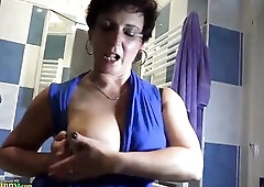 Old matures take off pants, brassiere and play with large ebony dildos