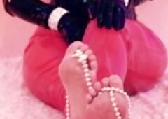 Raunchy latex model with large booty and natural breasts likes to entice.