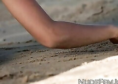 Exotic cutie Natalia playing on a sandy beach