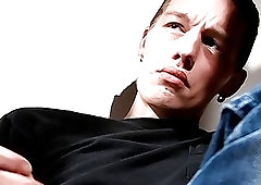 Dashing stud relaxes while smoking and stroking his dick solo