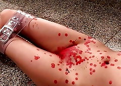 She's tortured with some candle wax by her assertive master