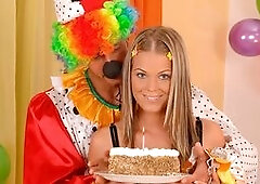 Teen cutie Trisha gets the birthday present she wanted: a good hard dick! The supplier of her present is a clown though and whilst some people are sca