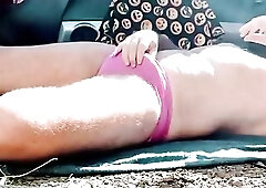 Caressing his dick throughout his pink underclothing