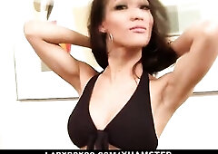 Bushy-haired ladyboy in ebony brassiere jerks off her large jock