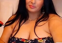 This sexy amateur video features a hot curvy MILF with big natural tits putting on a show for her fans. She teases and flaunts her BBW figure, big boo